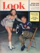 Look Magazine, February 10, 1953 - Arthur Godfrey putting on ice skates, with lovely skater Joan Walden
