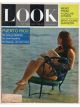 Look Magazine, March 24, 1964 - Woman reading the book “Post-historic man” while sitting in chair in the surf
