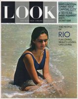 Look Magazine, June 4, 1963 - Woman in one piece swimming suit in the water’s edge