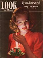 Look Magazine, December 29, 1942 - Lovely candlelit photo of woman holding Christmas candle